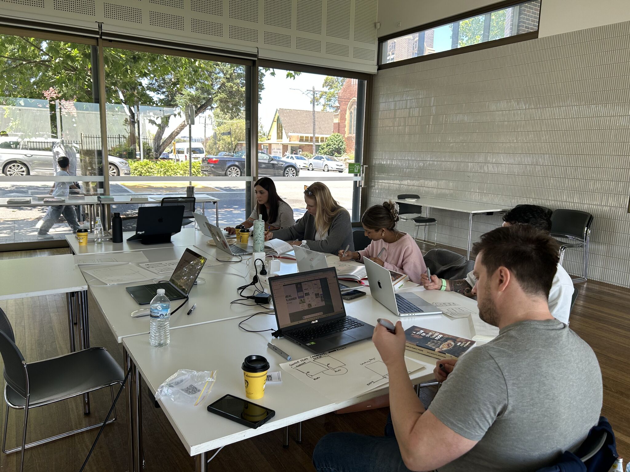 Focused students building their apps